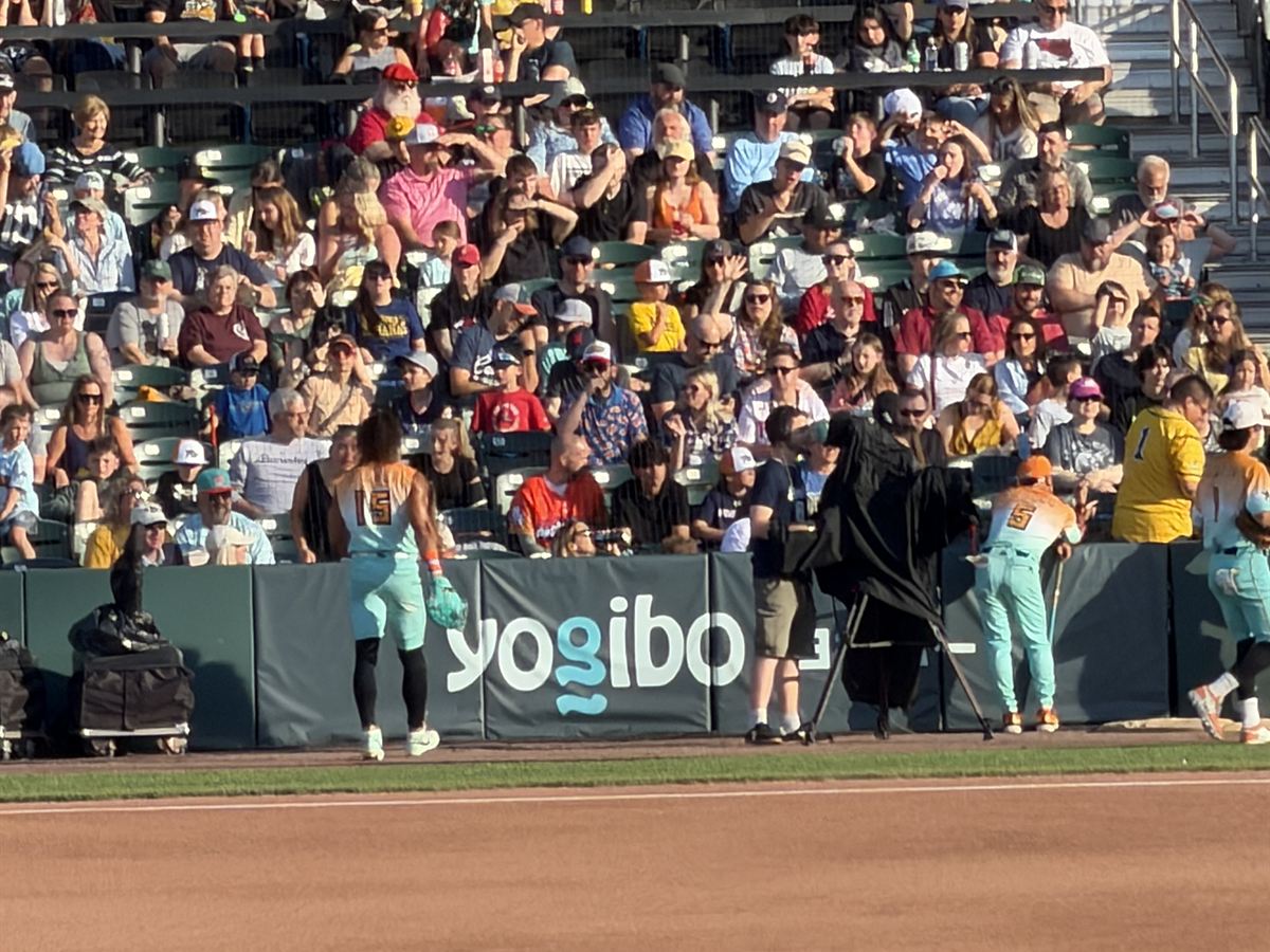 Yogibo signage along the outfield wall at a New Hampshire Fisher Cats game