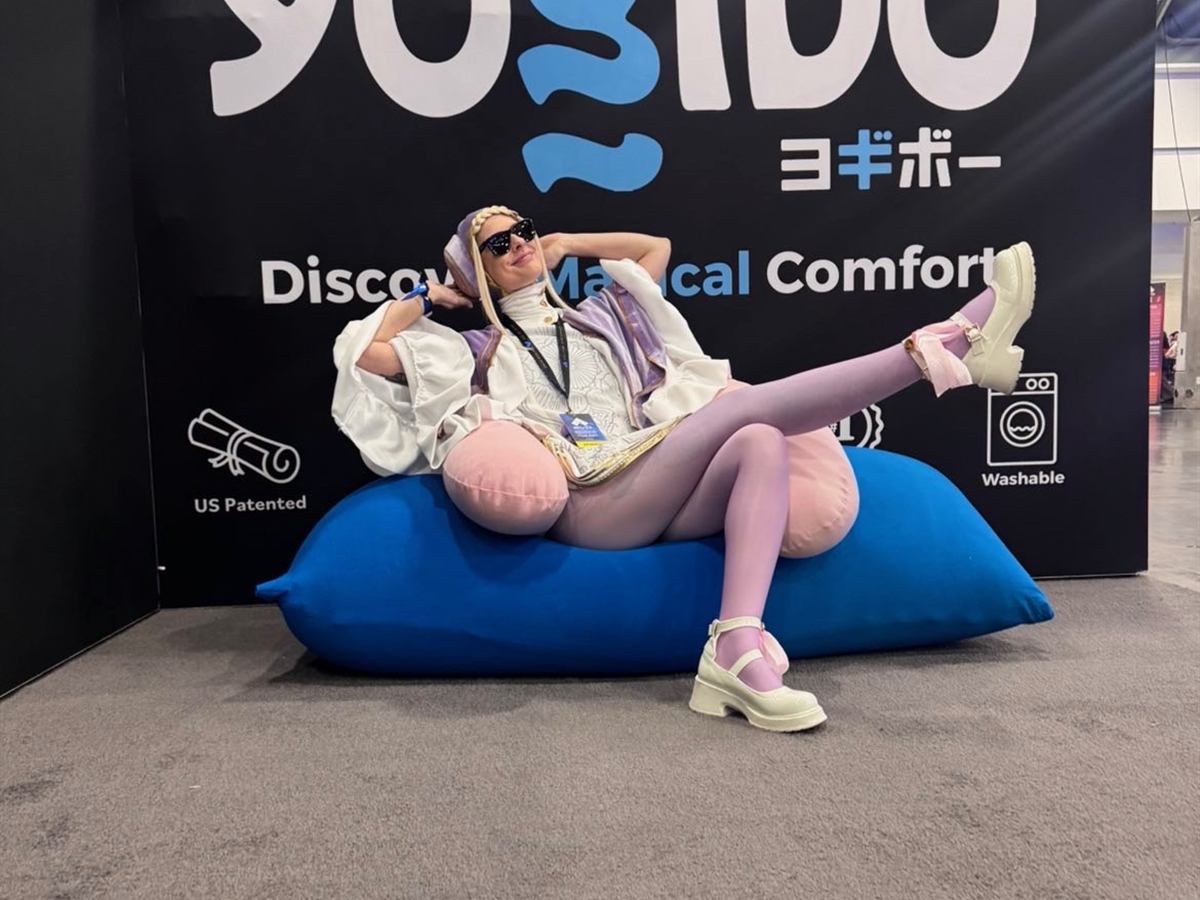 A cosplayer reclining on a blue Yogibo