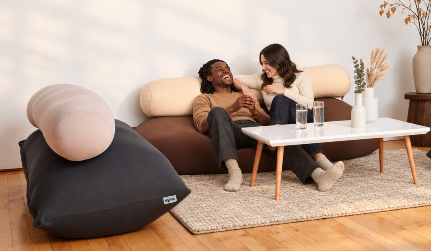 A couple relaxing together on a Yogibo bean bag sofa